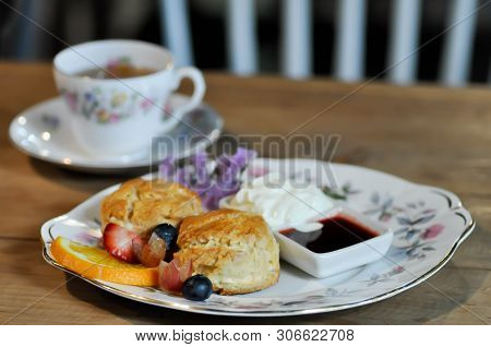 Scone Or Scone With Fruit ,whipping Cream And Sauce