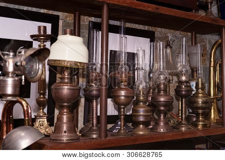 Many Kind Of Colorful Lamps On Wooden Shelf, The Paraffin Lamp Or Hand-held Lanterns Used In The Pas