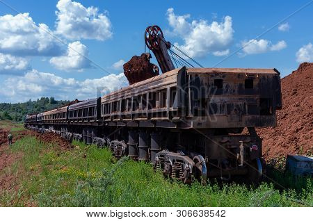 Excavator Loading Clay To The Train
