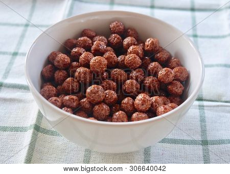 Chocolate Cornflakes In A Bowl, A Breakfast Cereal Made By Toasting Flakes Of Corn Or Maize.