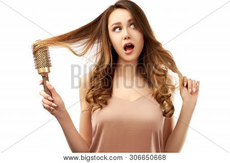 Puzzled Woman Raises Eyebrow In Bewilderment, Surprised Look  Free Space For Your Promotional Conten