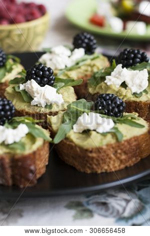 A Gourmet Lunch: A Plate Of Guacamole Sandwiches With Blackberries, Cream Cheese And Aragula, A Bowl