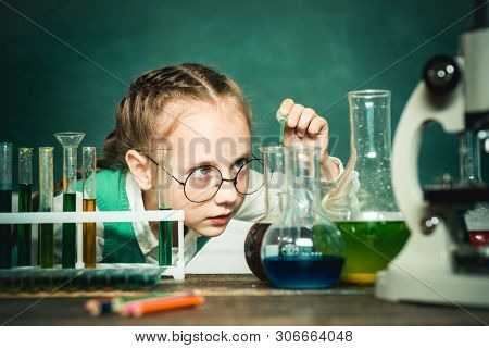 School Chemistry Lessons. Child In The Class Room With Blackboard On Background. School Concept. Che