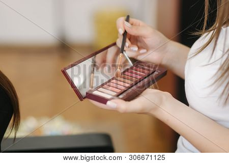 Makeup Artist Hold A Pelette And Put Brush For Work