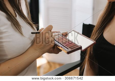 Makeup Artist Hold A Pelette And Put Brush For Work