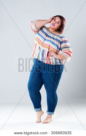 Plus Size Fashion Model In Casual Clothes, Fat Woman On Gray Background, Body Positive Concept