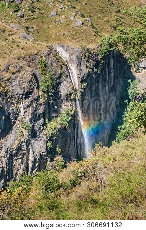 A Waterfall On Manaslu Circuit With Around Mount Manaslu (8 156 Meters). Himalayas, Sunny Day At Man