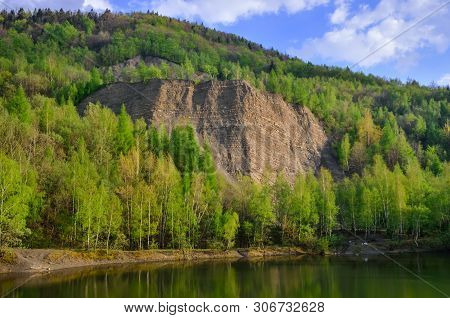Beautiful Spring Mountain Landscape. Quarry In The Mountains By The Lake.