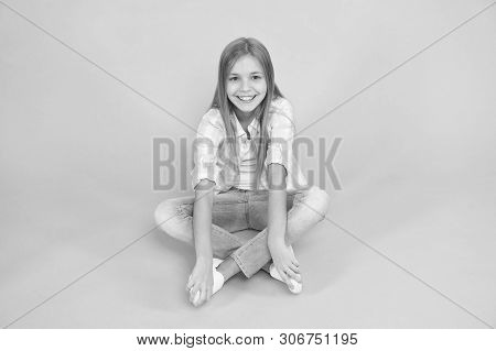 Find Place To Relax. Girl Happy Face Sit On Floor Attentive Looking At Camera Turquoise Background. 