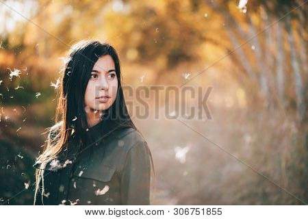 Dreamy Beautiful Girl In White Fluff On Bokeh Background With Yellow Leaves In Golden Sunlight. Insp