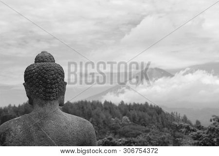 Budha Statue Of Borobudur Temple With Background Of Sumbing Mountain