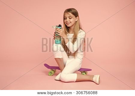 Happy Little Girl Relax On Penny Board. Little Girl Happy Smiling With Water Bottle On Board. Relax 