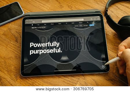 Paris, France - Jun 6, 2019: Man Reading On Apple Ipad Pro Tablet About Latest Announcement Of At De