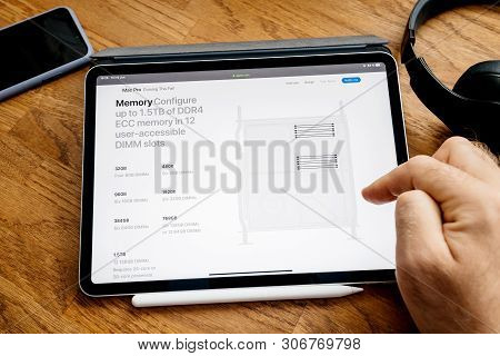Paris, France - Jun 6, 2019: Man Reading On Apple Ipad Pro Tablet About Latest Announcement Of At De