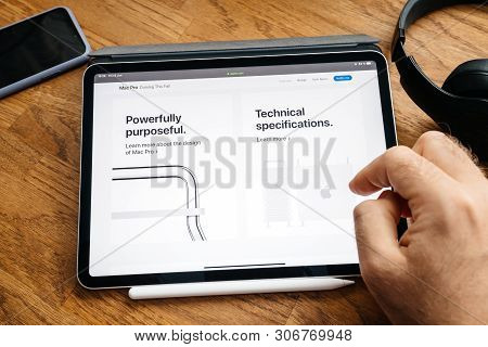 Paris, France - Jun 6, 2019: Man Reading On Apple Ipad Pro Tablet About Latest Announcement Of At De