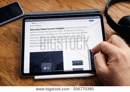 Paris, France - Jun 6, 2019: Man Reading On Apple Ipad Pro Tablet About Latest Announcement Of At De