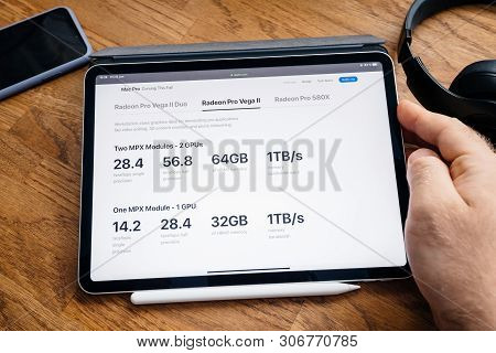 Paris, France - Jun 6, 2019: Man Reading On Apple Ipad Pro Tablet About Latest Announcement Of At De
