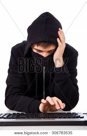 Troubled Hacker With A Computer Keyboard On The White Background