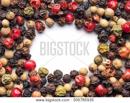Mixed Peppercorns Background With White Copy Space In Center. Food Background With Peppercorns. Diff