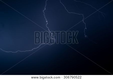 Lightning in the night sky during a severe thunderstorm