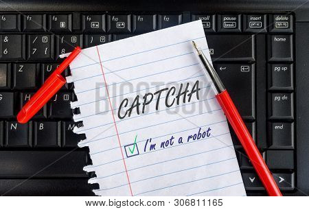 Paper Sheet Width Words Captcha I Am Not A Robot On Laptop Keyboard