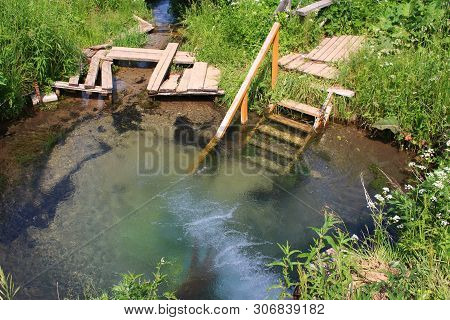 Bath In Cold Spring Water Near The Monastery. Borovsky District, Russia