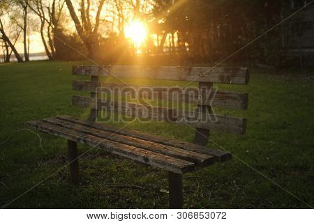 Old Bench In A Parkette At Sunset At Lake Simcoe