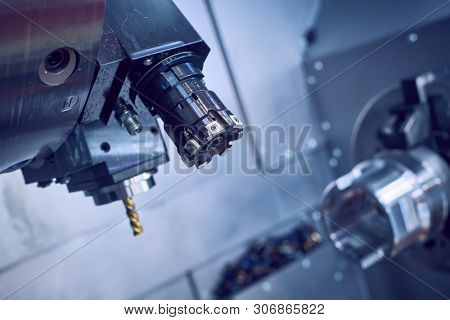 cnc machine at metalwork industry. milling multitool precision manufacturing and metal machining