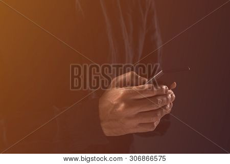 Guy Typing Text Message On Mobile Phone. Handsome Adult Man In Black Shirt Is Texting On Smartphone 