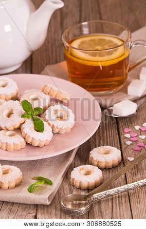 Canestrelli Biscuits With Mint On Wooden Table.