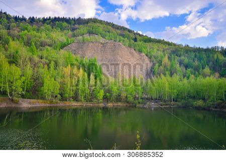 Beautiful Spring Mountain Landscape. Quarry In The Mountains By The Lake.