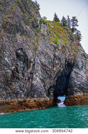 A Cave In Th Erock Formations On Aialik Bay In Fjords National Park Near Seward Alaska.
