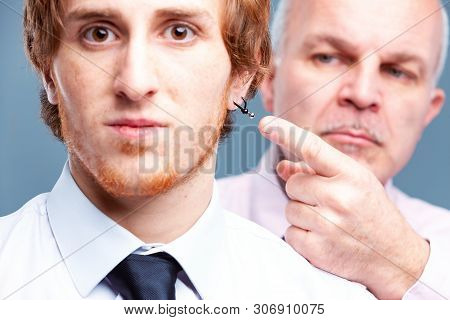 Conservative Businessman Pointing To An Earring