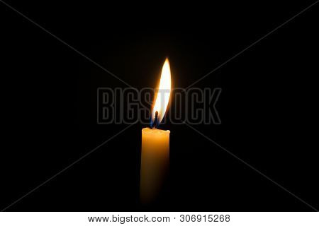 Candle Light. One Candle Of Black Background