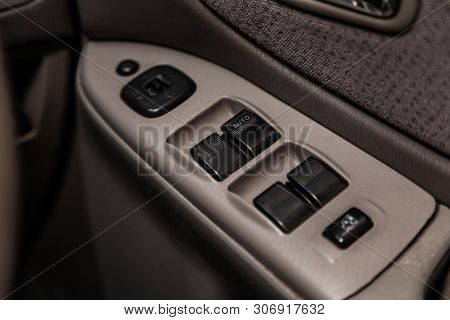 Novosibirsk, Russia - June 14, 2019:  Mazda Capella,  Close-up Of The Side Door Buttons: Window Adju