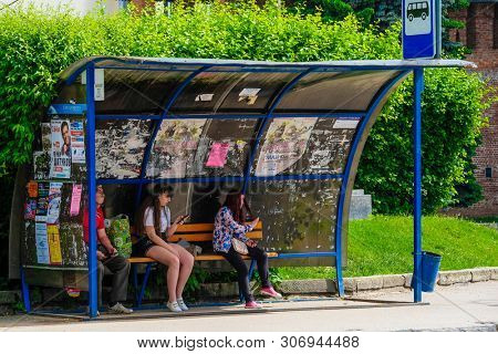 Smolensk, Russia - May, 26, 2019: image of people waiting for a bus at a bus stop in Smolensk, Russia