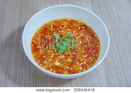 Thai Food Style, Top View Of Spicy Seafood Dipping Sauce Sprinkled With Coriander Slice In White Bow