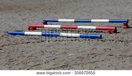 Image Of Show Jumping Poles On The Training Field. Wooden Barriers For Jumping Horses As A Backgroun