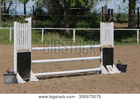 Image Of Show Jumping Poles On The Training Field. Wooden Barriers For Jumping Horses As A Backgroun
