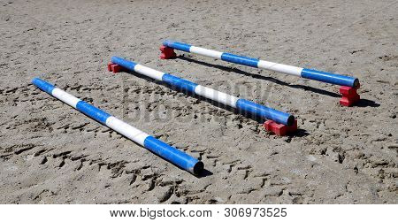 Image Of Show Jumping Poles On The Training Field. Wooden Barriers For Jumping Horses As A Backgroun