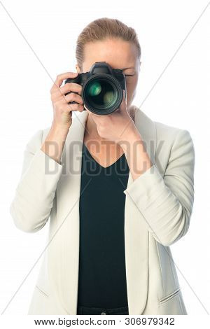 Beautiful Young Photographer With Camera In Professional Studio