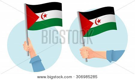 Sahrawi Arab Democratic Republic Flag In Hand. Patriotic Background. National Flag Of Sahrawi Arab D
