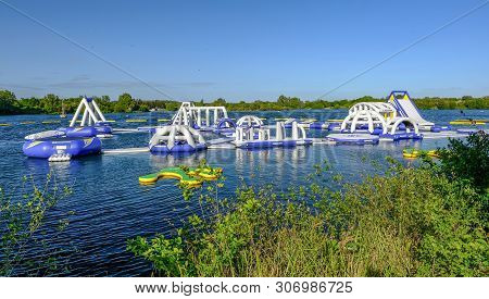 Fairlop, Essex, Uk - May 16, 2019: View Of The Aqua Bounce Floating Obstacle Course, Newly Installed