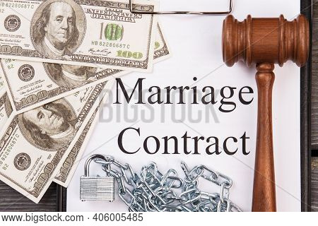 Marriage Contract And Wooden Gavel. Dollars And Metal Chains. Top View Flat Lay.