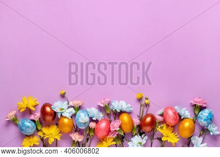Easter Background With Easter Eggs And Spring Flowers.