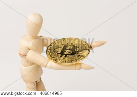 Wooden Mannequin With Bitcoins. Сryptocurrency Concept. Space For Text