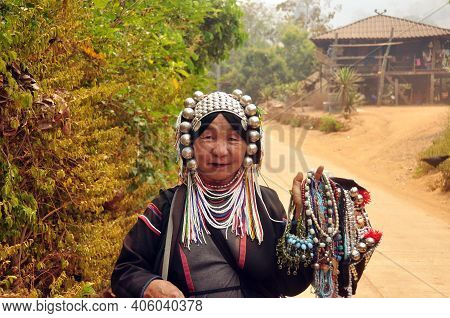 Chiang Mai, Thailand - March 1, 2013: Mature Ethnic Woman With Traditional Attire In Authentic Gown 
