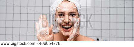 Happy Woman Showing Palm With Foam Cleanser In Bathroom, Banner