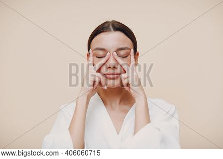 Young Woman Doing Face Building Facial Gymnastics Self Massage And Rejuvenating Exercises