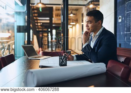 Dreamy Drafter Sitting At The Office Desk